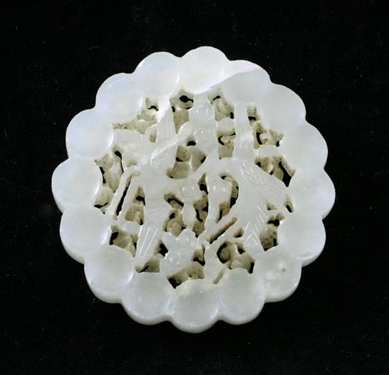 A Chinese pale celadon jade disc, 17th / 18th century, 4.2cm